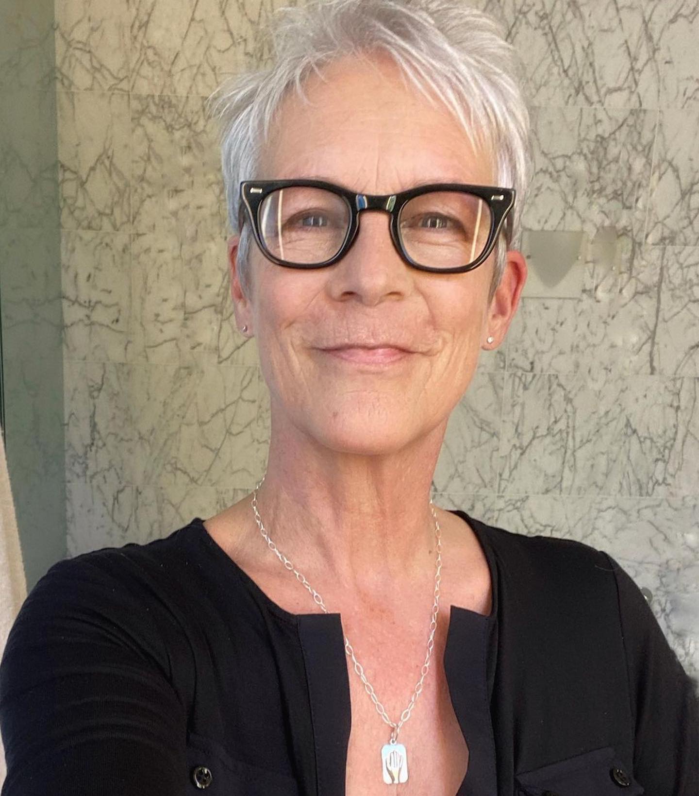 Image may contain Jamie Lee Curtis Blonde Hair Person Accessories Jewelry Necklace Adult Face Head and Pixie Cut