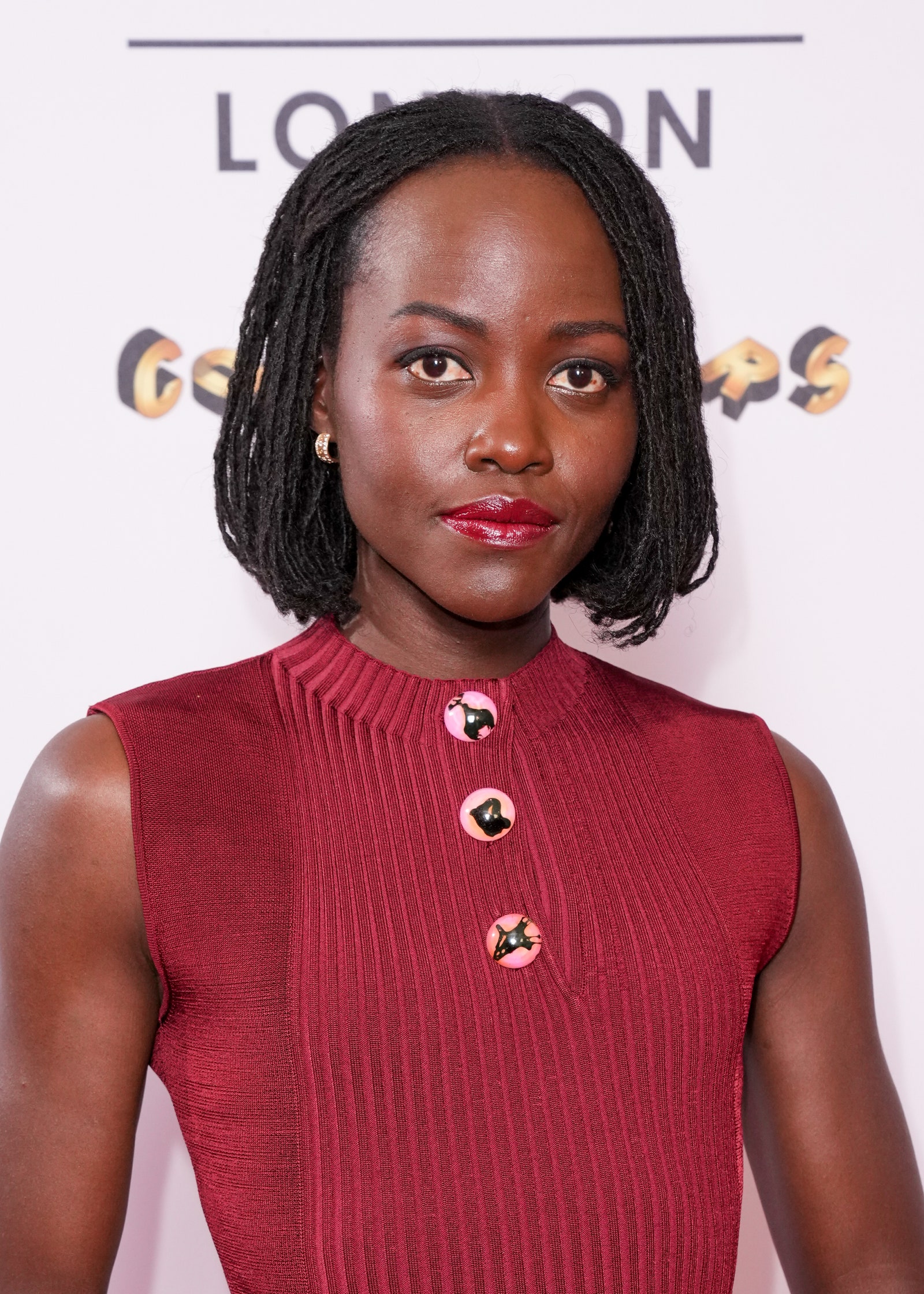 Image may contain Lupita Nyong'o Head Person Face Black Hair Hair Body Part Neck Adult Photography and Portrait