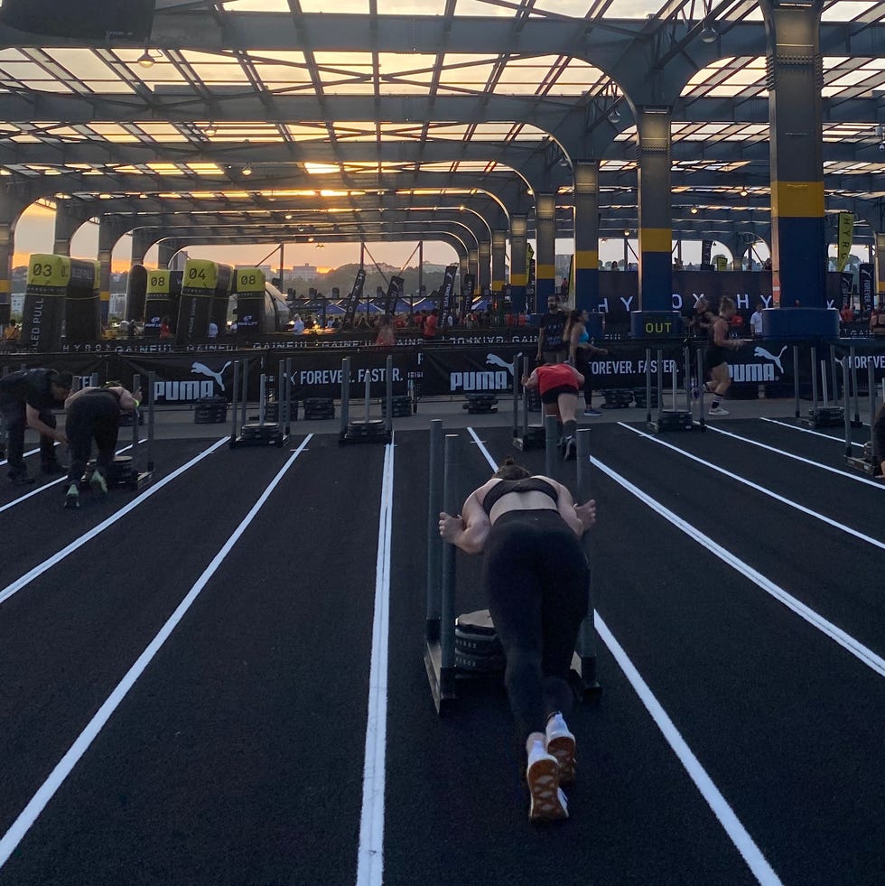 talene competing in the sled push portion of the race at hyrox nyc 2024 on pier 76