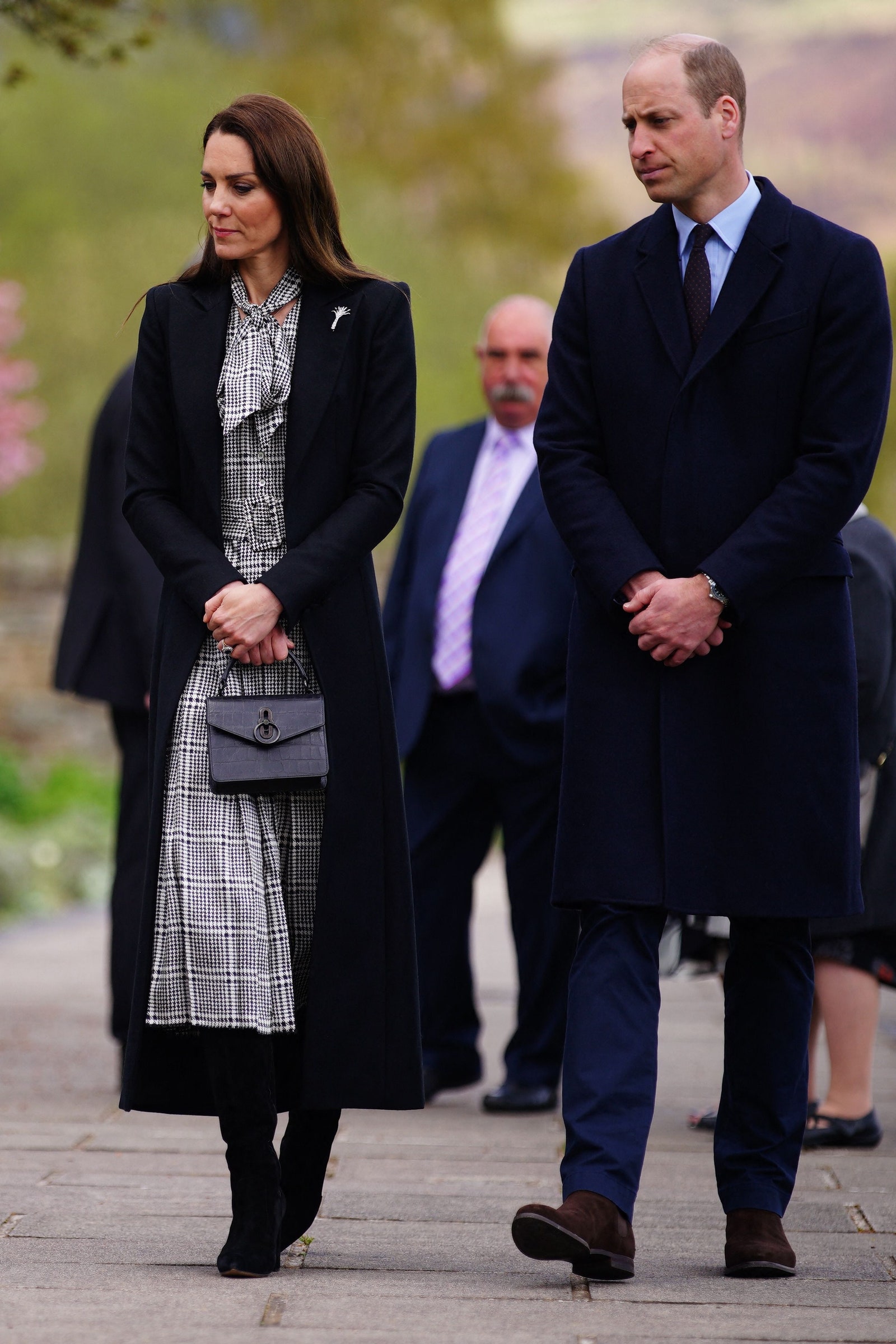 Image may contain Prince William Duke of Cambridge Person Clothing Coat Accessories Formal Wear Tie and Adult