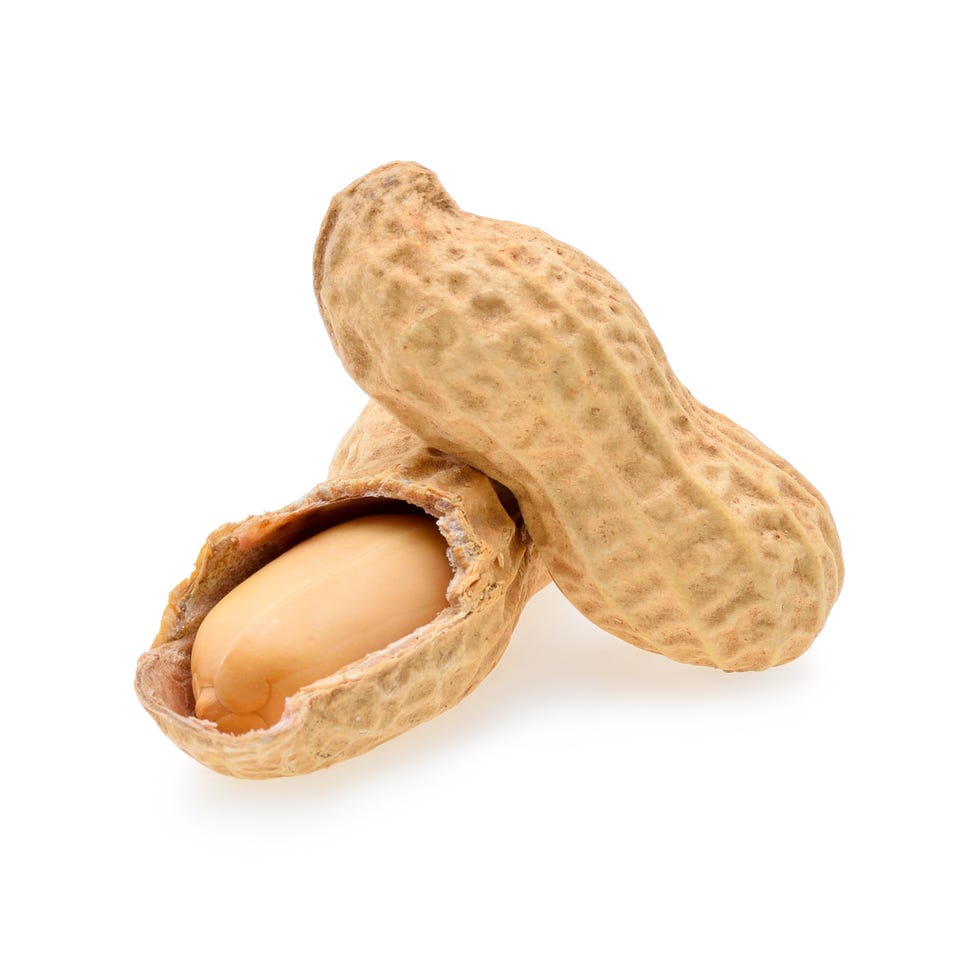 Close-Up Of Peanuts Against White Background