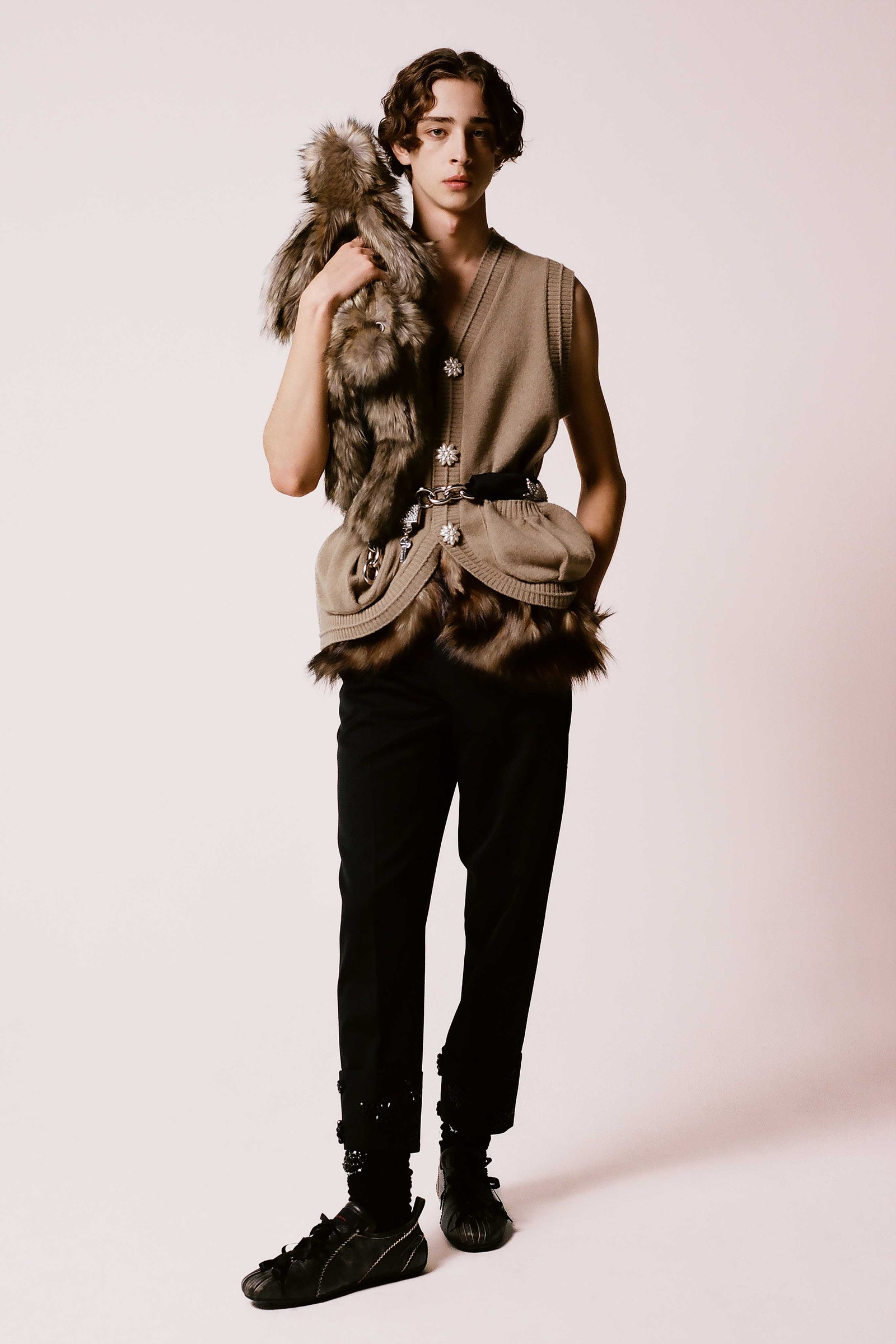 Image may contain Accessories Bag Handbag Adult Person Clothing Pants Footwear Shoe Glove Face and Head