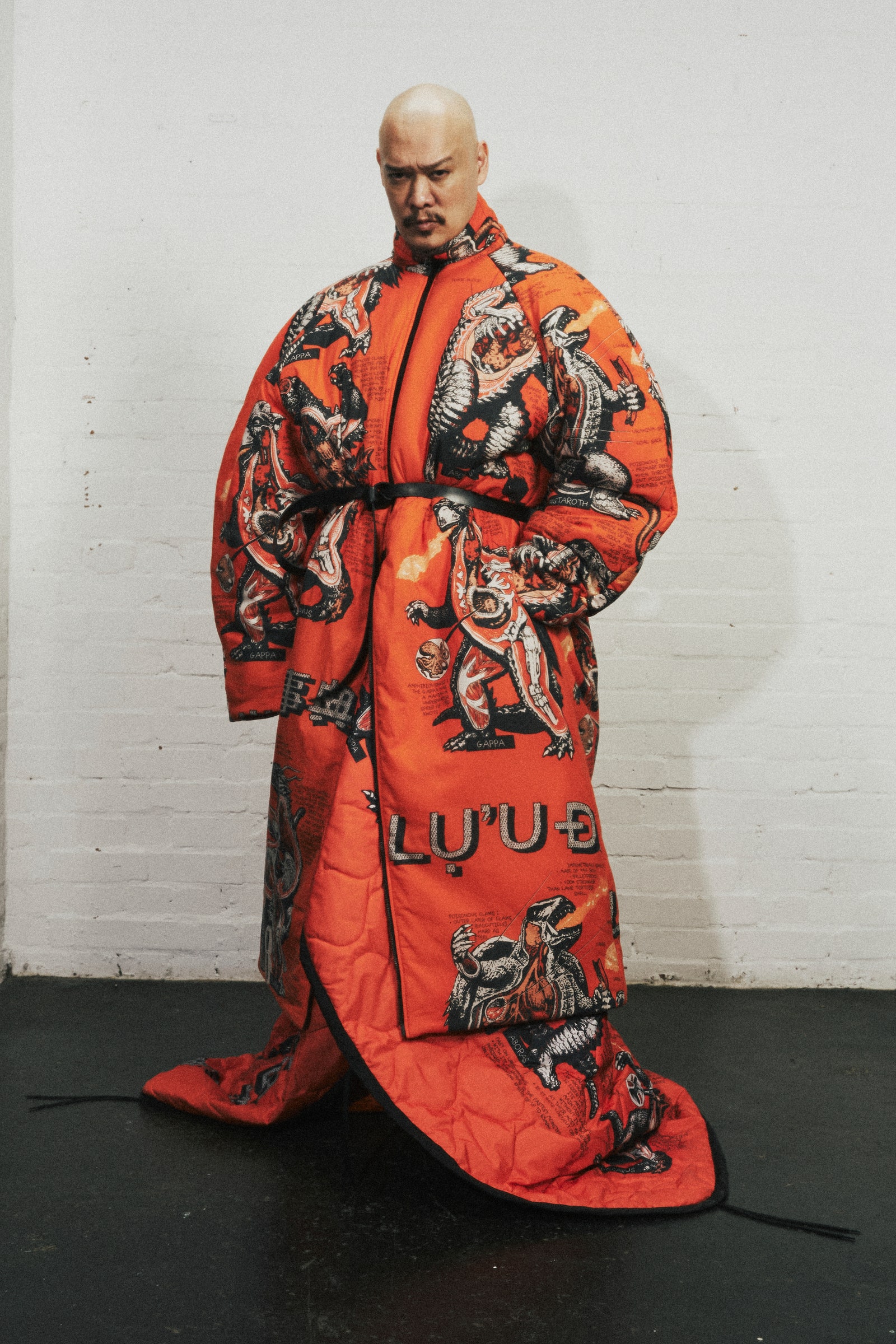Image may contain Raymond S. Persi Fashion Clothing Dress Formal Wear Gown Robe Adult Person and Coat