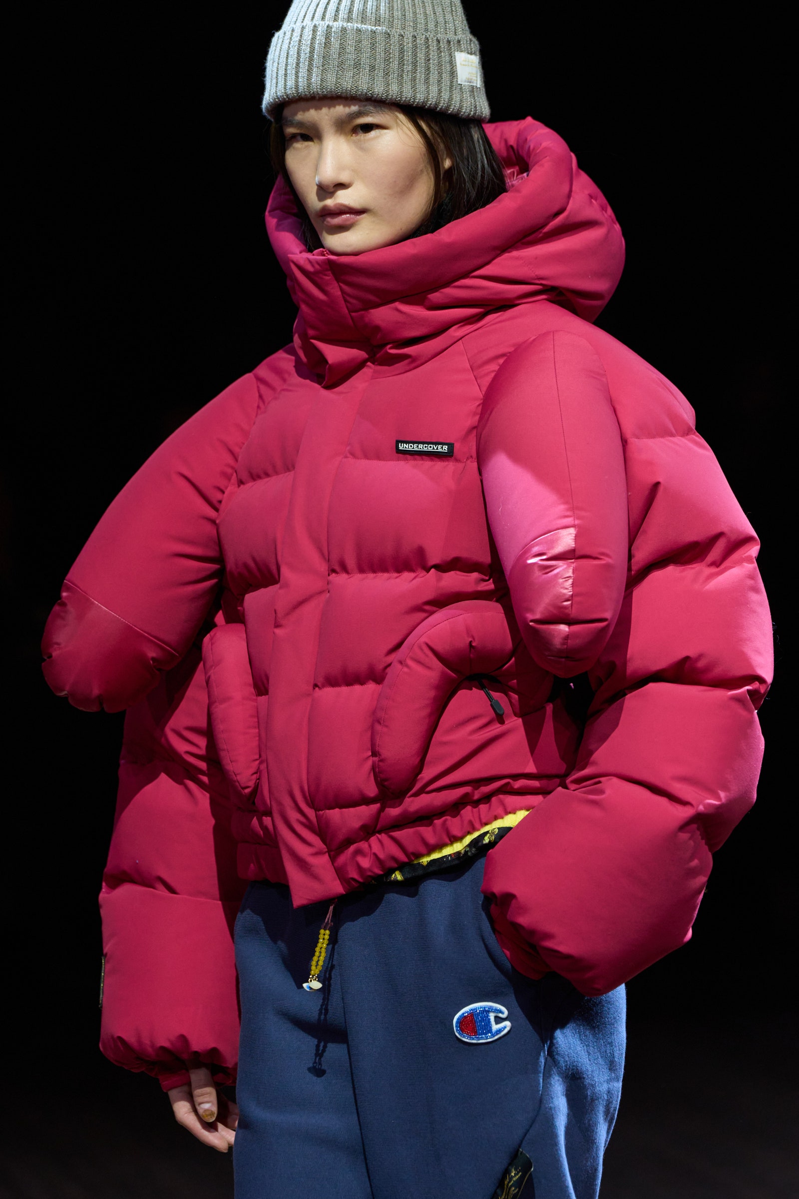 Image may contain Clothing Coat Jacket Hood Hat Adult Person and Cap