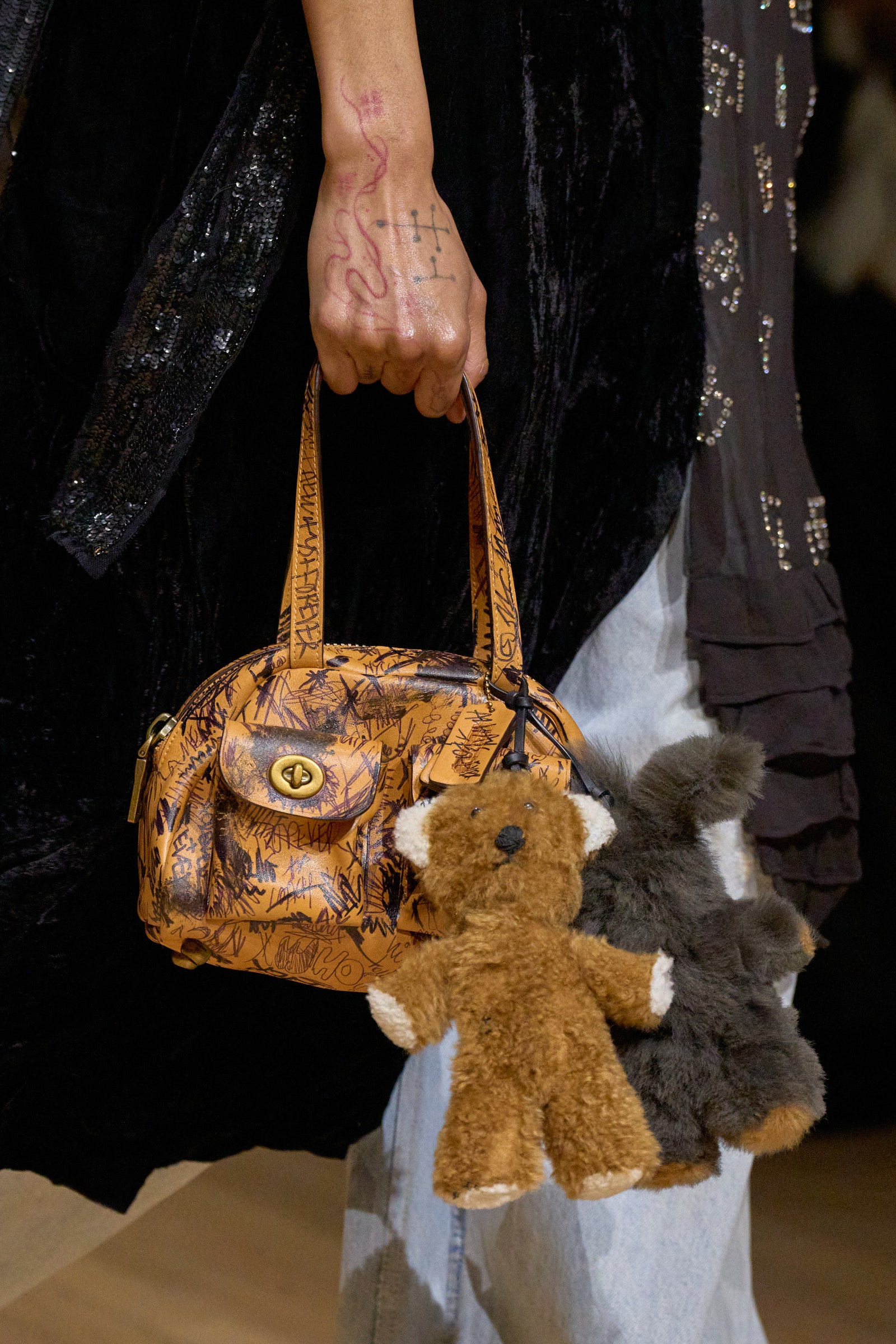 Image may contain Accessories Bag Handbag Toy Purse Body Part Finger Hand Person Art Handicraft and Adult
