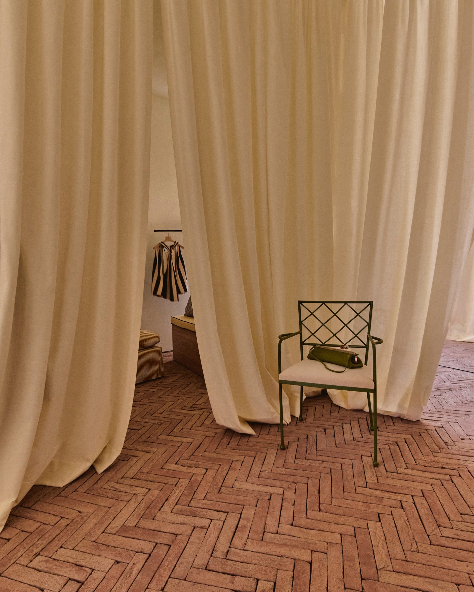 Image may contain Floor Indoors Interior Design Flooring Chair Furniture Accessories Bag Handbag Couch and Texture