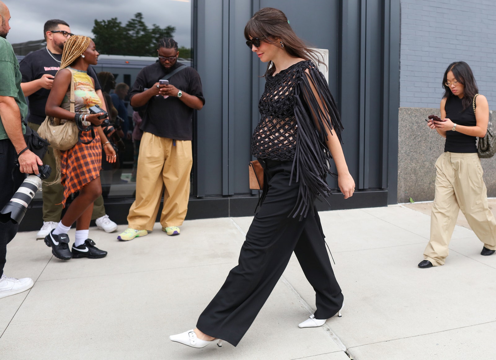 Image may contain Person Walking People Accessories Bag Handbag Clothing Footwear Shoe Adult Teen and Dancing