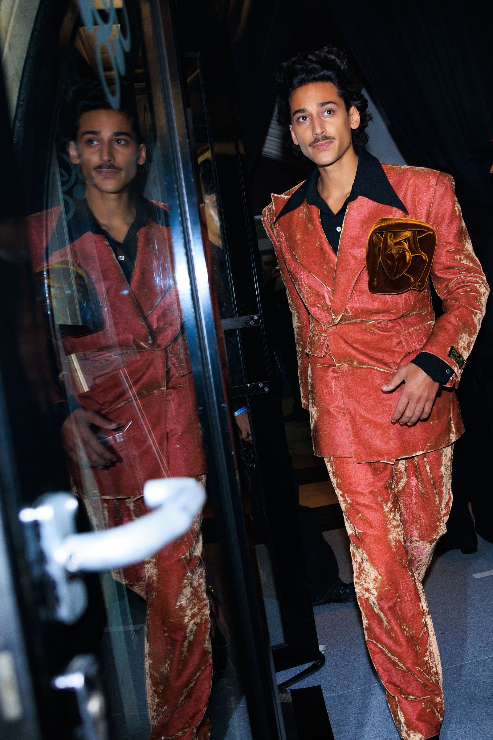 Image may contain Tiger Shroff Tiger Shroff Velvet Clothing Coat Jacket Fashion Adult Person and Formal Wear