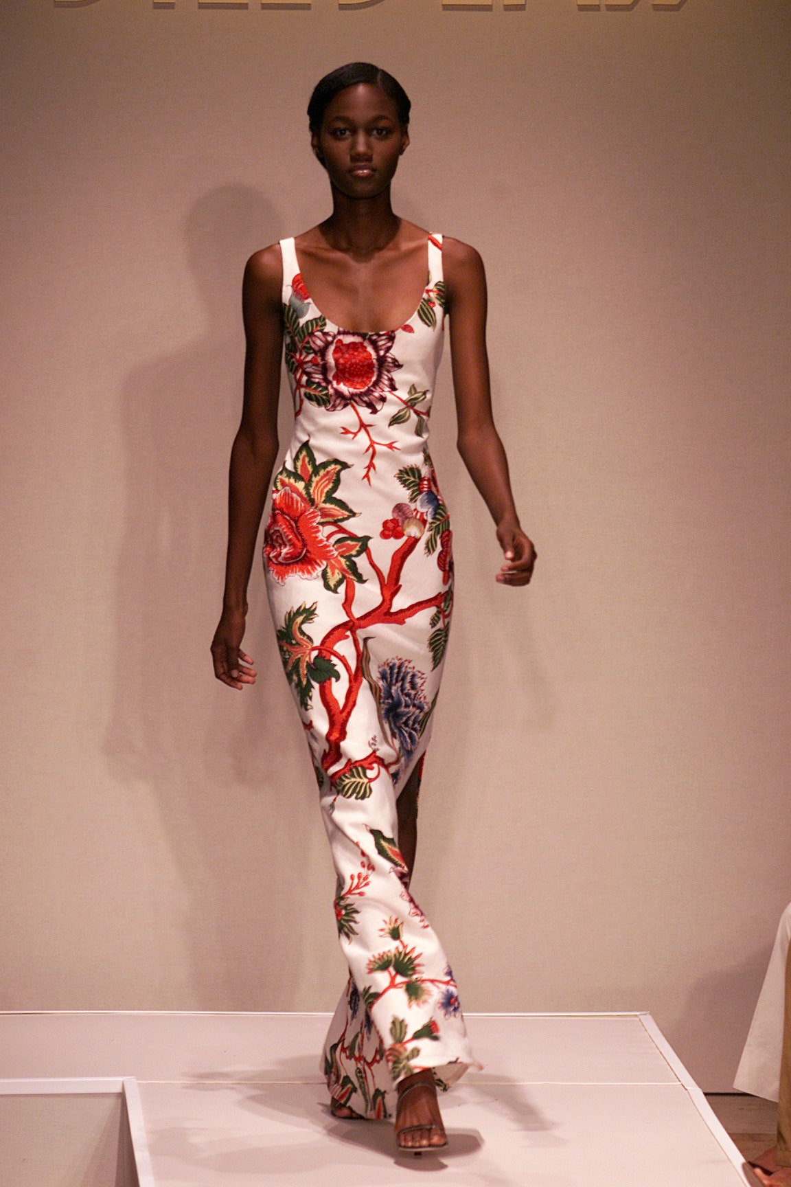 Image may contain Gloria Jones Clothing Dress Formal Wear Fashion Adult Person Gown Footwear High Heel and Shoe