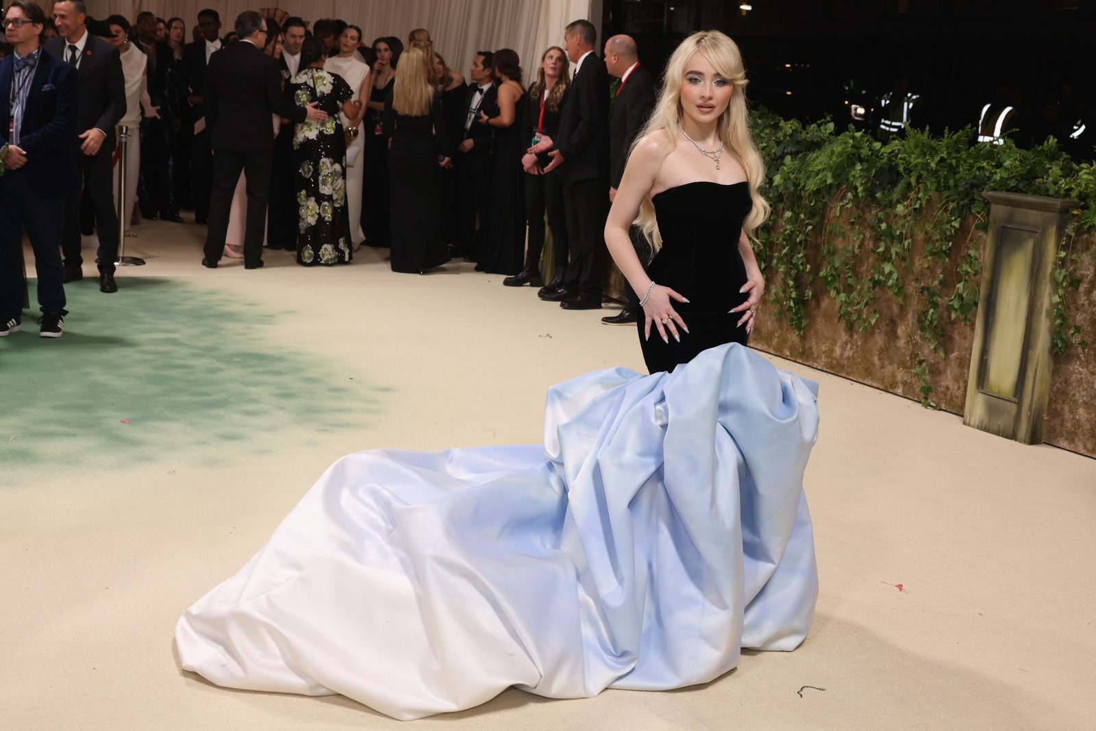Image may contain Sabrina Carpenter Clothing Dress Formal Wear Fashion Gown Wedding Wedding Gown Adult and Person
