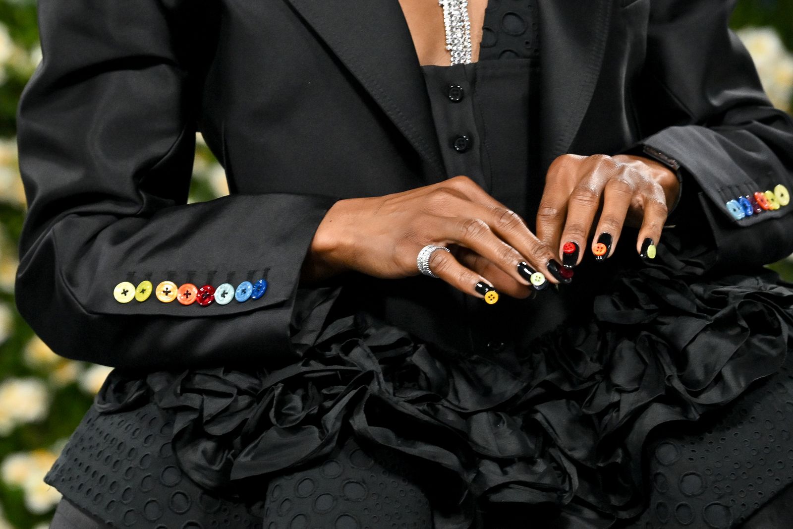Image may contain Accessories Jewelry Ring Body Part Finger Hand Person Adult Nail and Formal Wear