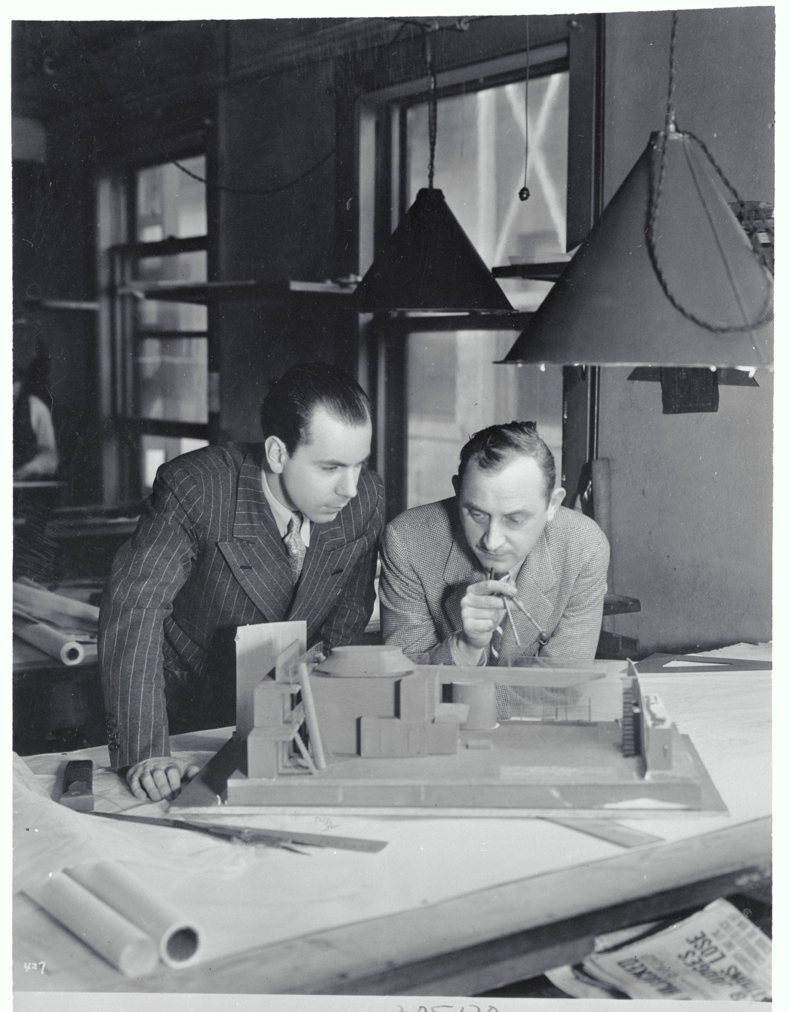 Image may contain Basil Radford George Fenneman Lamp Furniture Table Adult Person Face Head and Photography