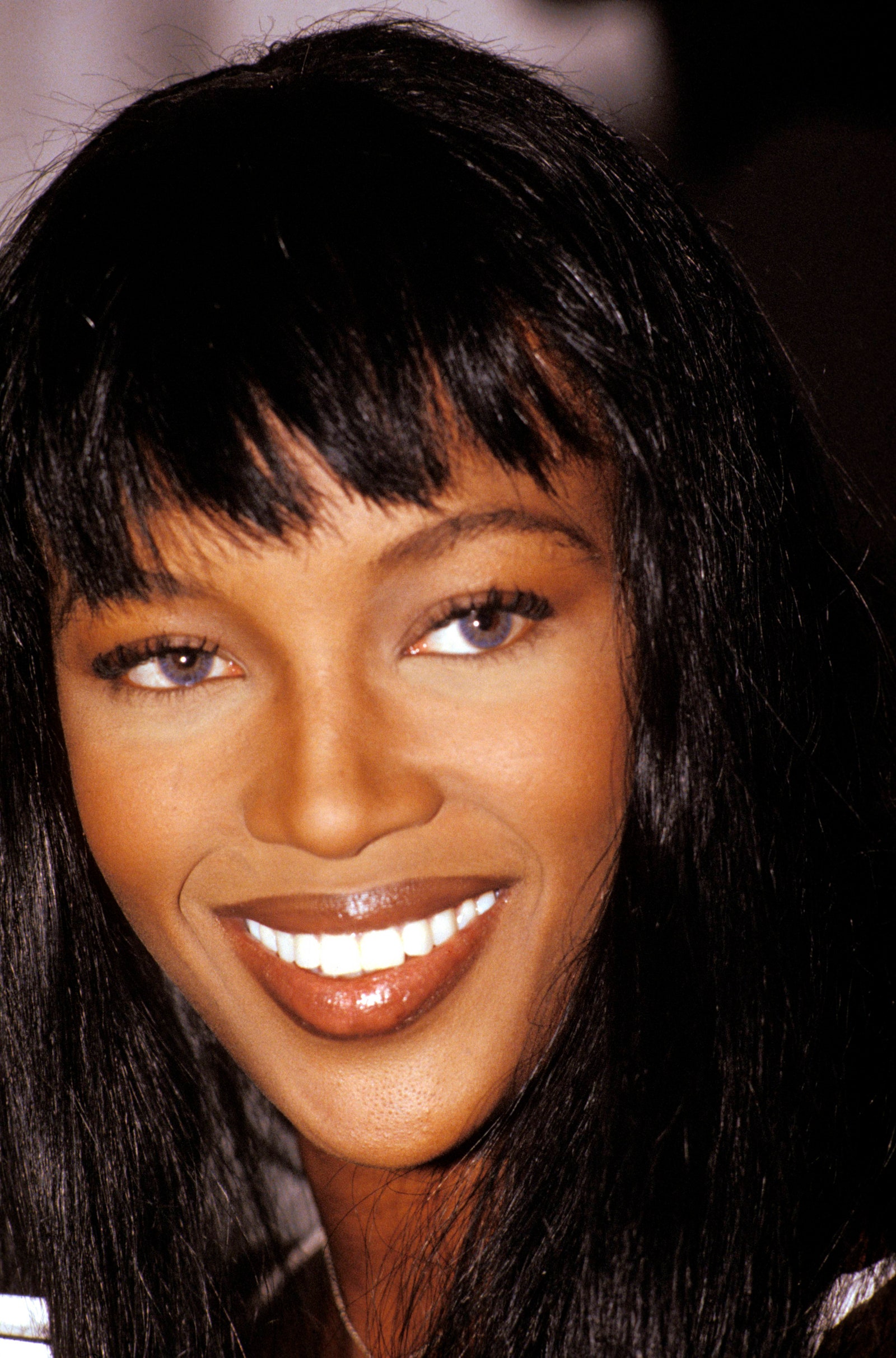 Image may contain Naomi Campbell Head Person Face Adult Happy Smile Black Hair Hair and Dimples