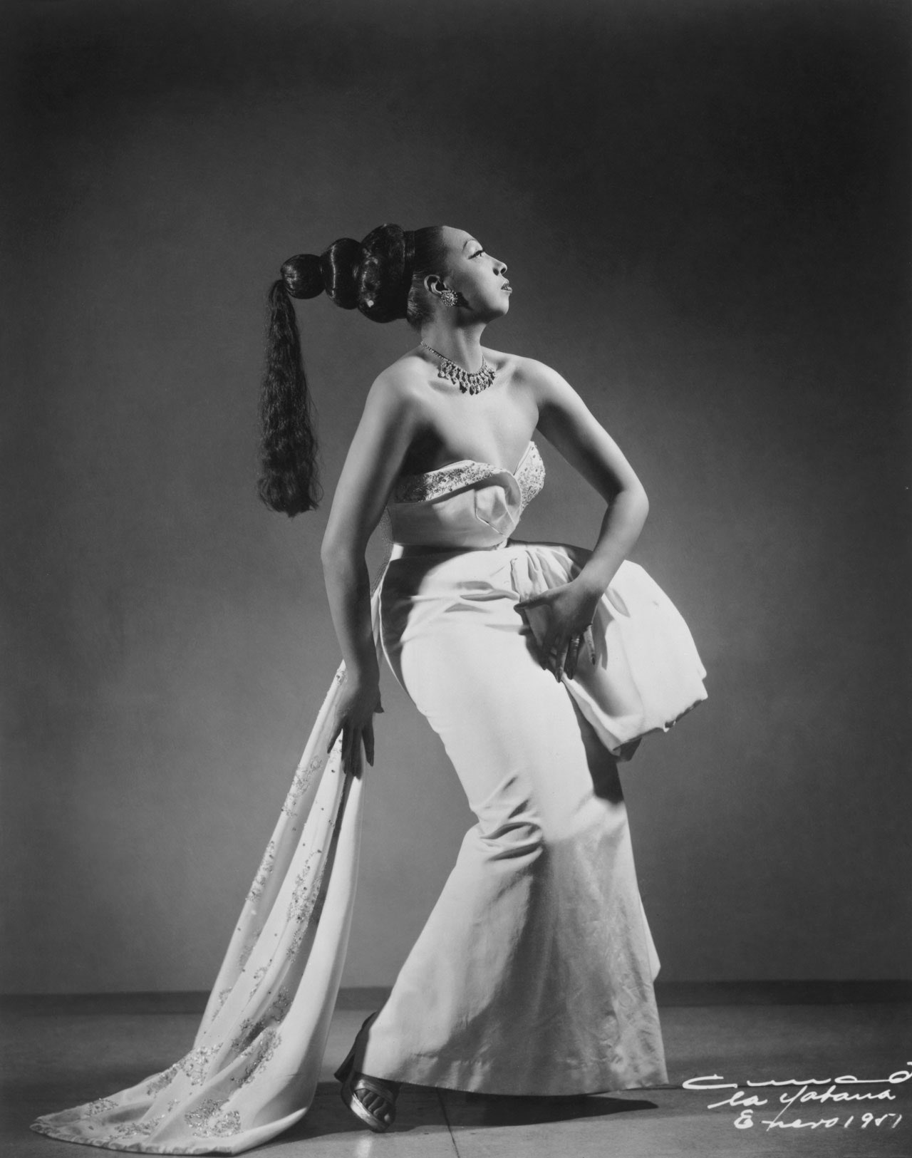 Image may contain Josephine Baker Clothing Dress Adult Person Formal Wear Dancing Leisure Activities and Fashion