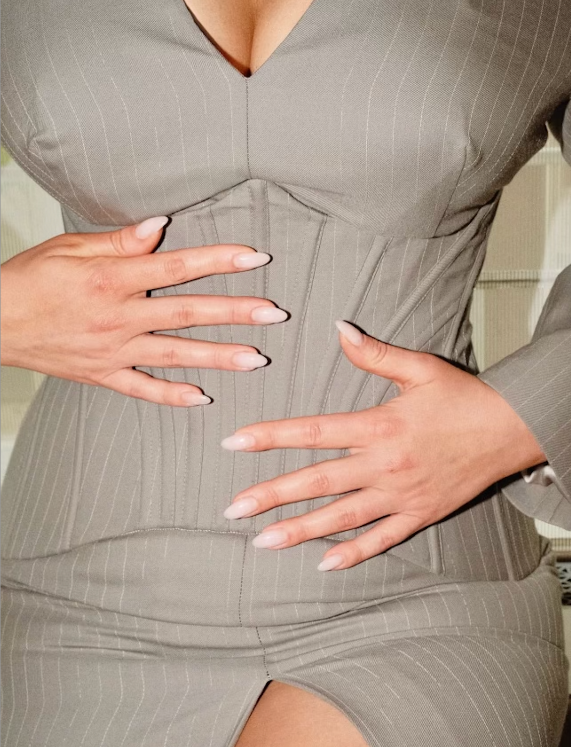 Image may contain Clothing Dress Body Part Finger Hand Person Formal Wear Adult and Nail