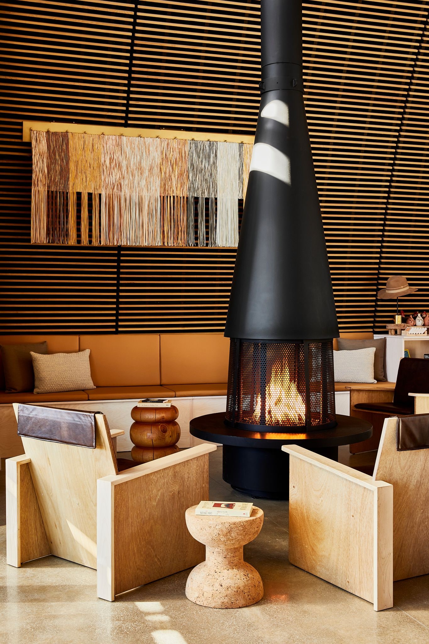 Image may contain Indoors Interior Design Lamp Clothing Hat Home Decor Architecture Building Foyer and Accessories