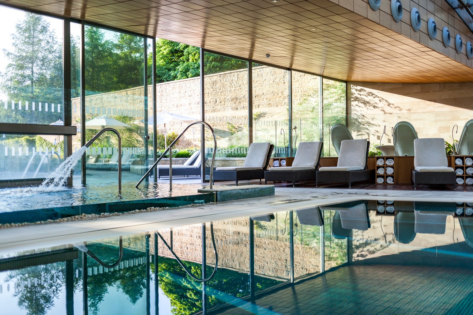 Image may contain Pool Water Swimming Pool Chair Furniture Indoors Interior Design Architecture Building and Hotel