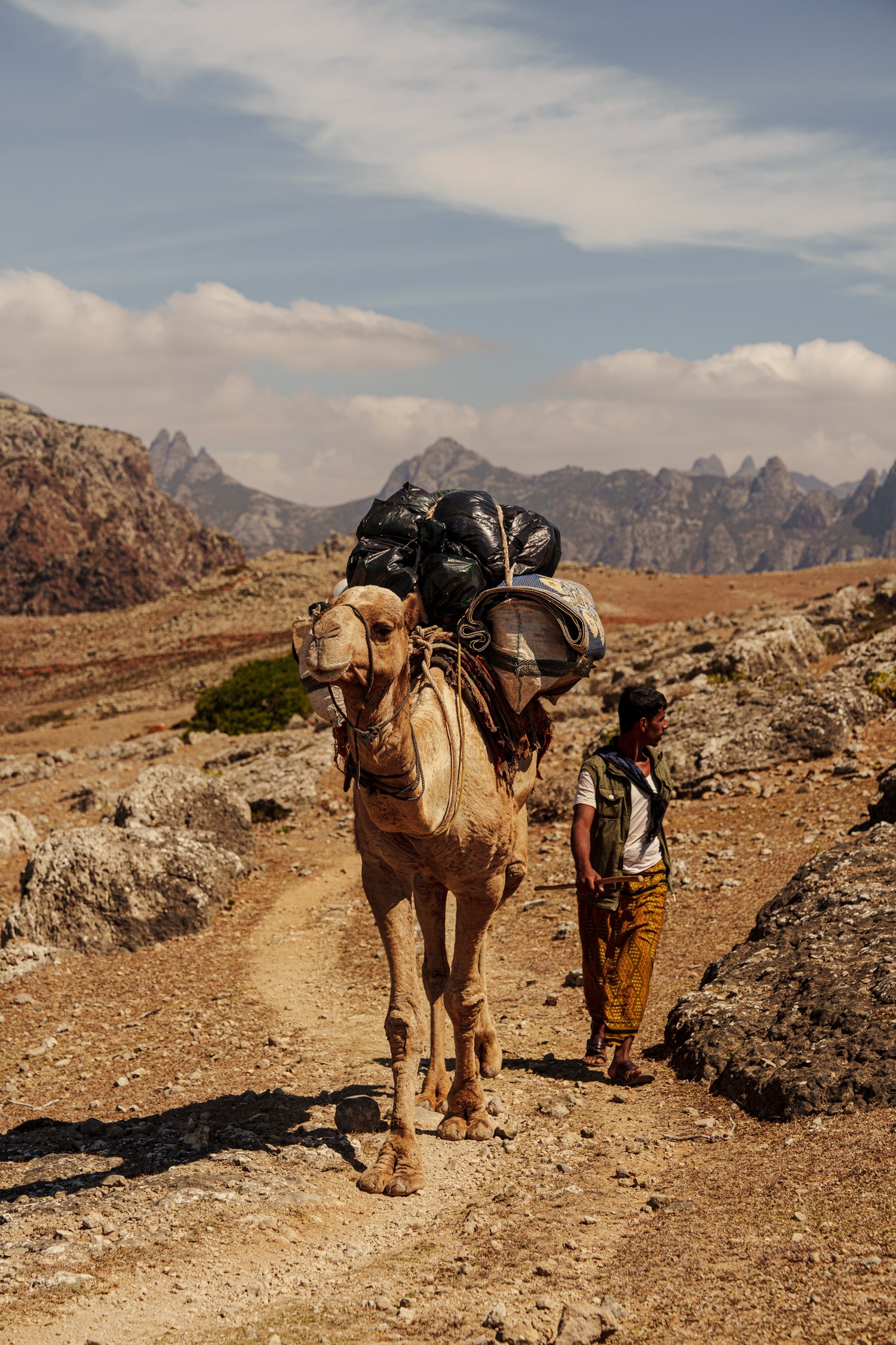 Image may contain Bag Adult Person Backpack Backpacking Clothing Footwear and Shoe