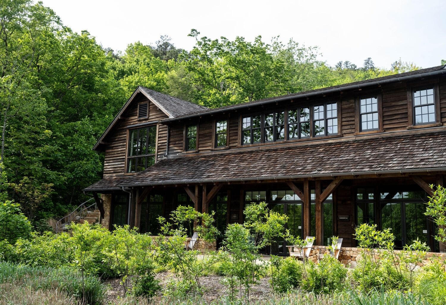 Image may contain Architecture Building Cottage House Housing Cabin Nature Outdoors Scenery Chair and Furniture