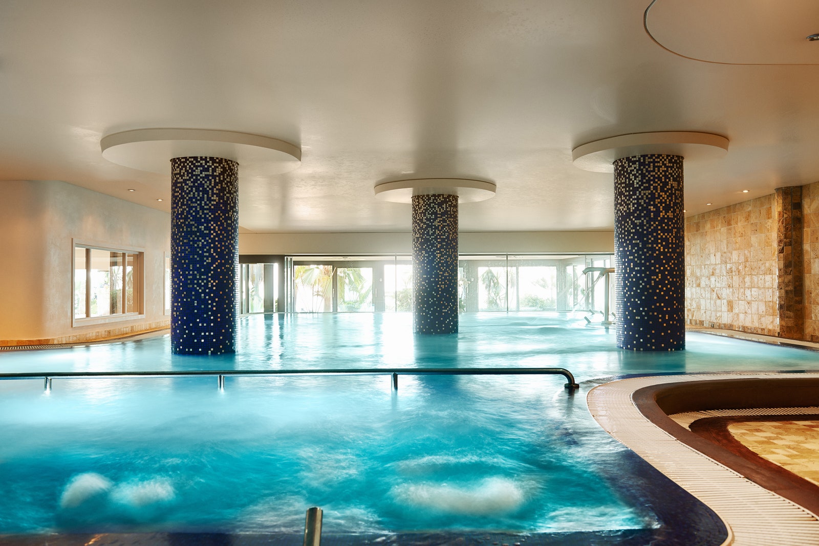Image may contain Pool Water Architecture Building Hotel Swimming Pool Resort Hot Tub and Tub
