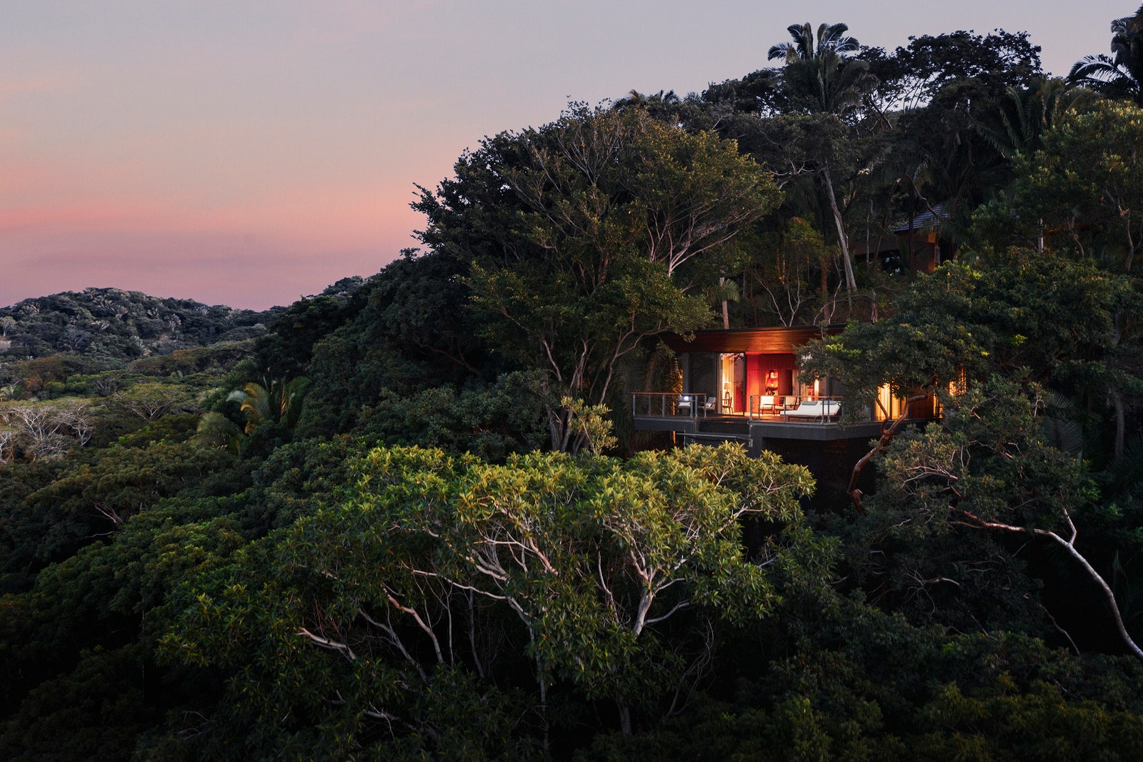 Image may contain Land Nature Outdoors Plant Rainforest Tree Vegetation Architecture Building Hotel and Resort