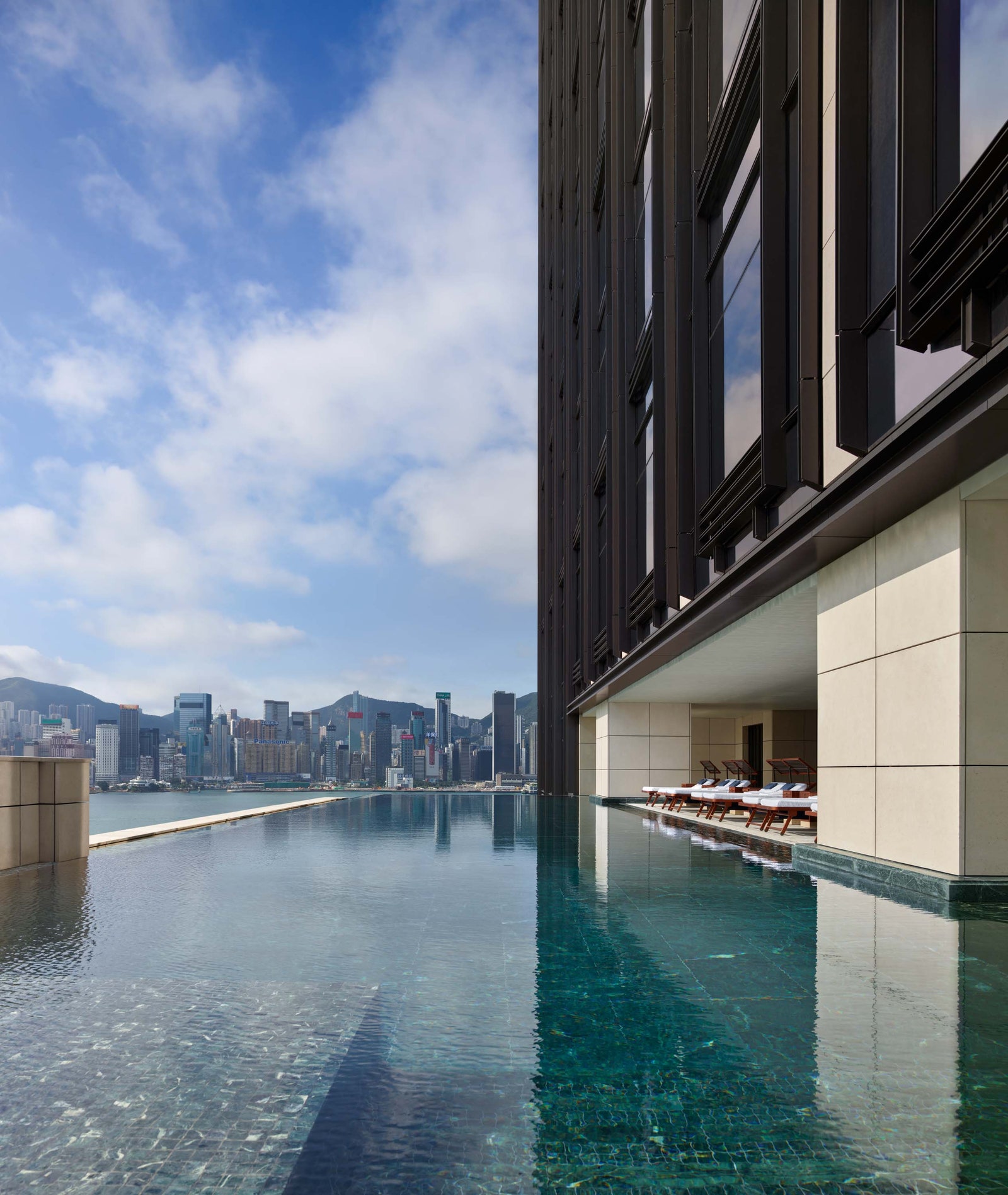 Image may contain City Pool Water Swimming Pool Urban Architecture Building Office Building Cityscape and Condo