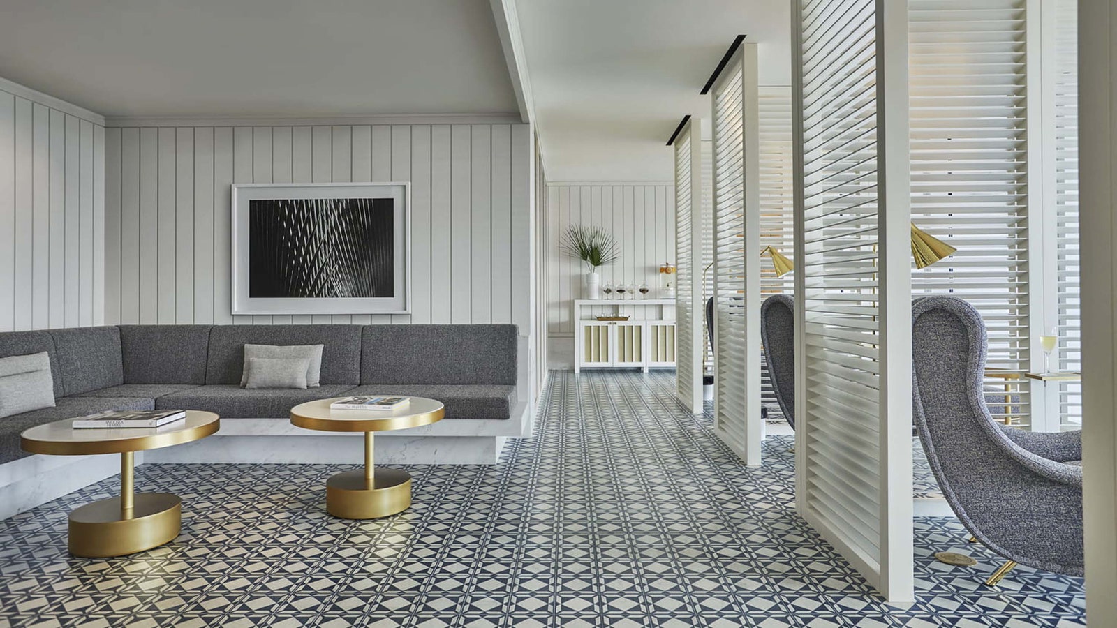 Image may contain Book Publication Home Decor Indoors Interior Design Floor Architecture Building Foyer and Couch