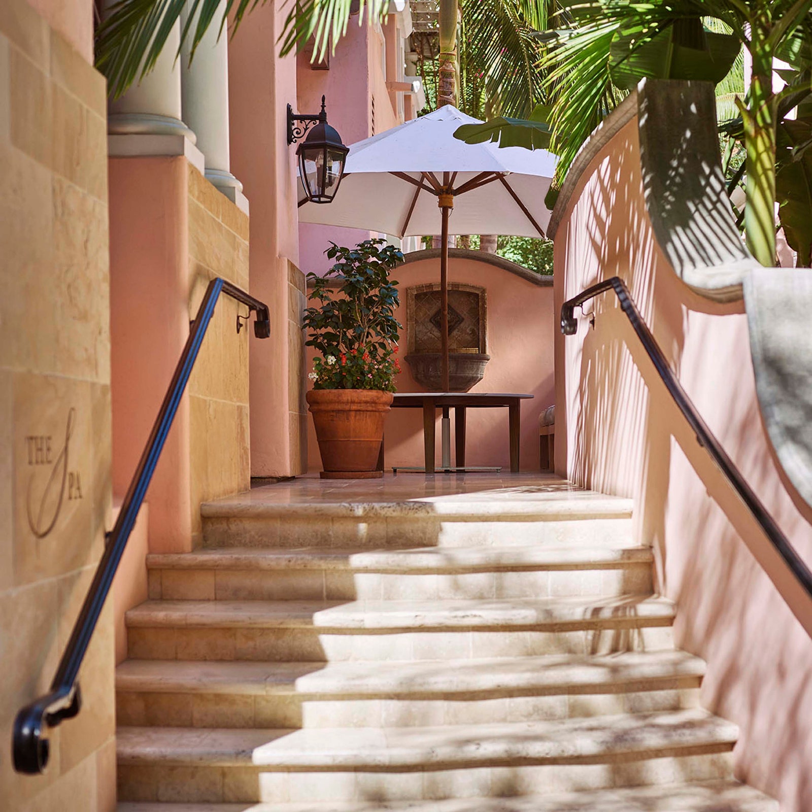 Image may contain Lamp Handrail Architecture Building House Housing Staircase Plant Desk Furniture and Table
