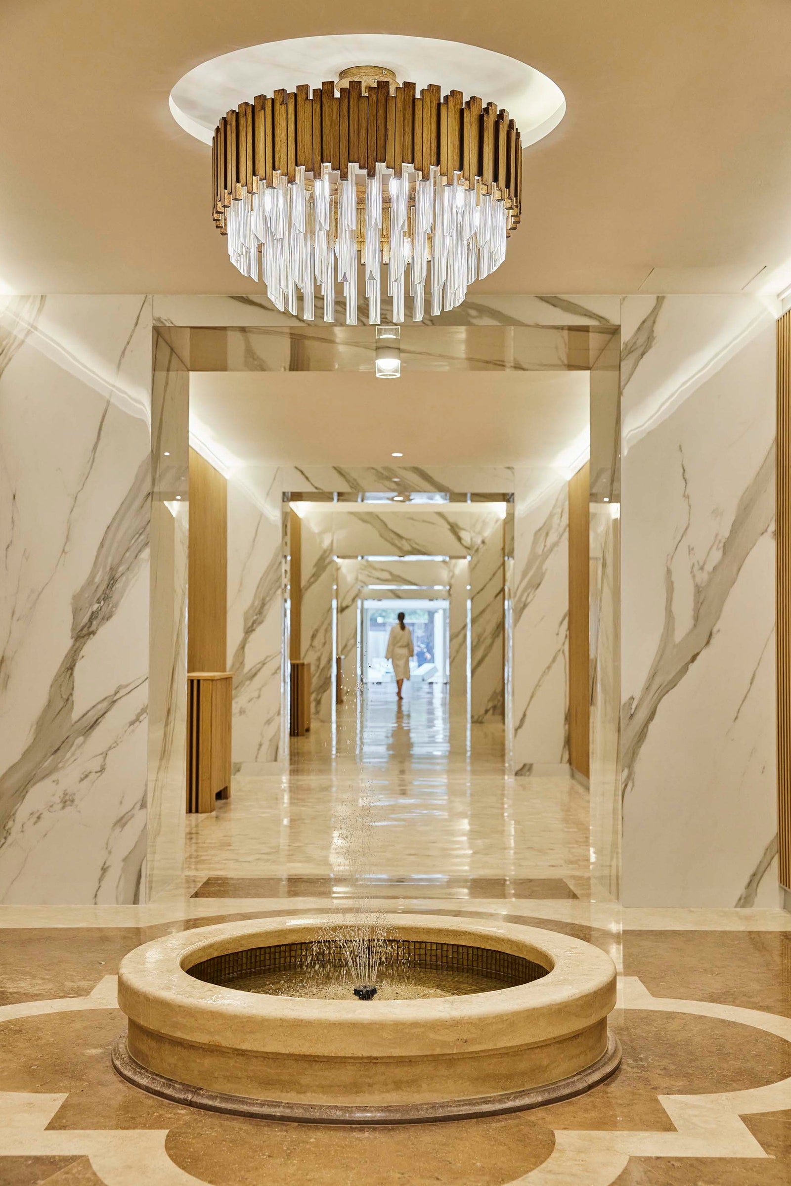 Image may contain Floor Indoors Person Architecture Building Foyer Lamp and Flooring