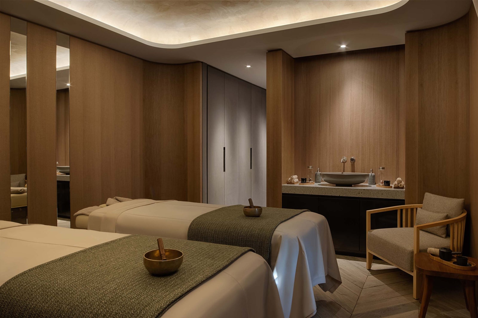 Image may contain Chair Furniture Sink Bed Spa Sink Faucet and Cup