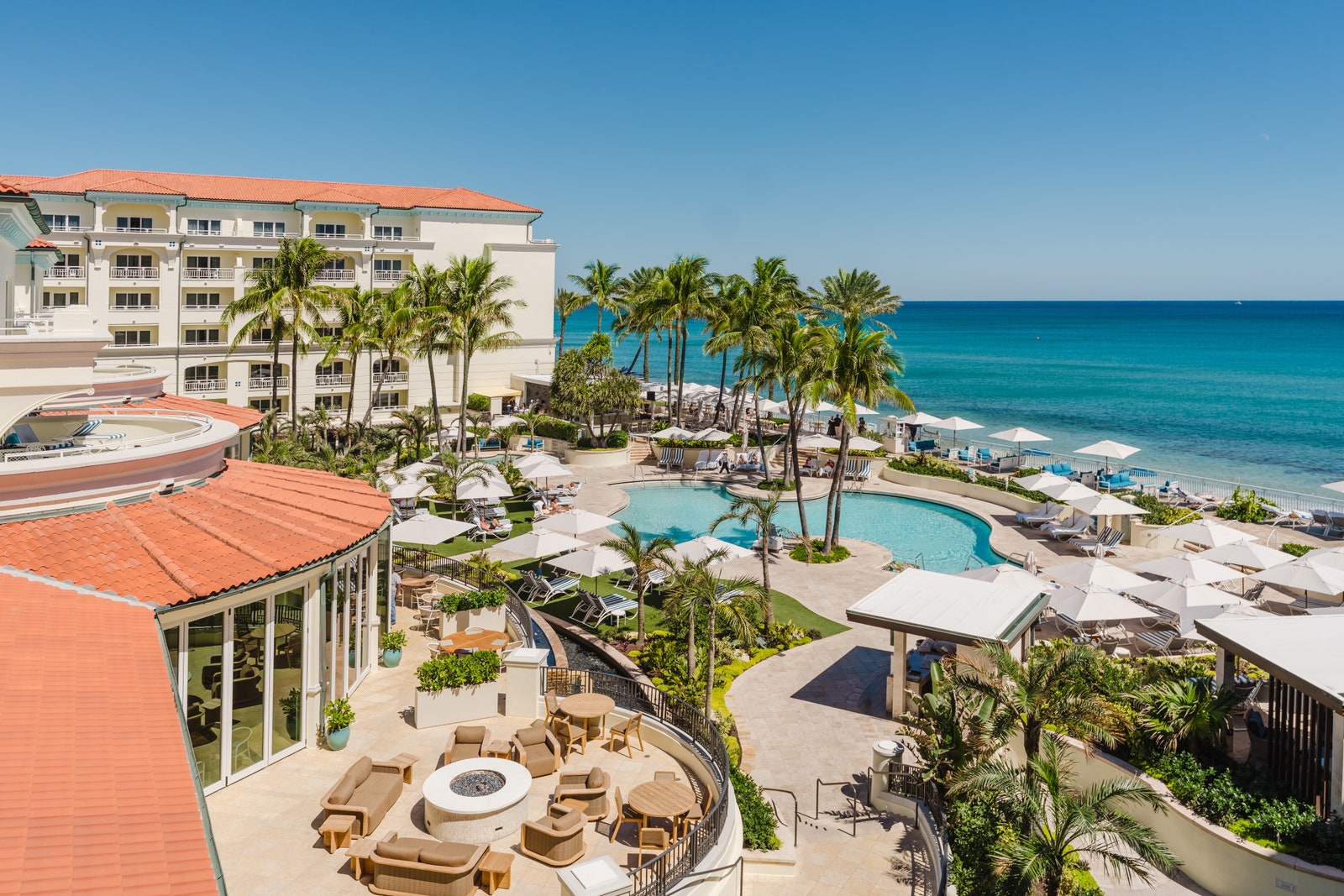Image may contain Plant Pool Water Architecture Building Hotel Resort Swimming Pool Outdoors Waterfront and Nature